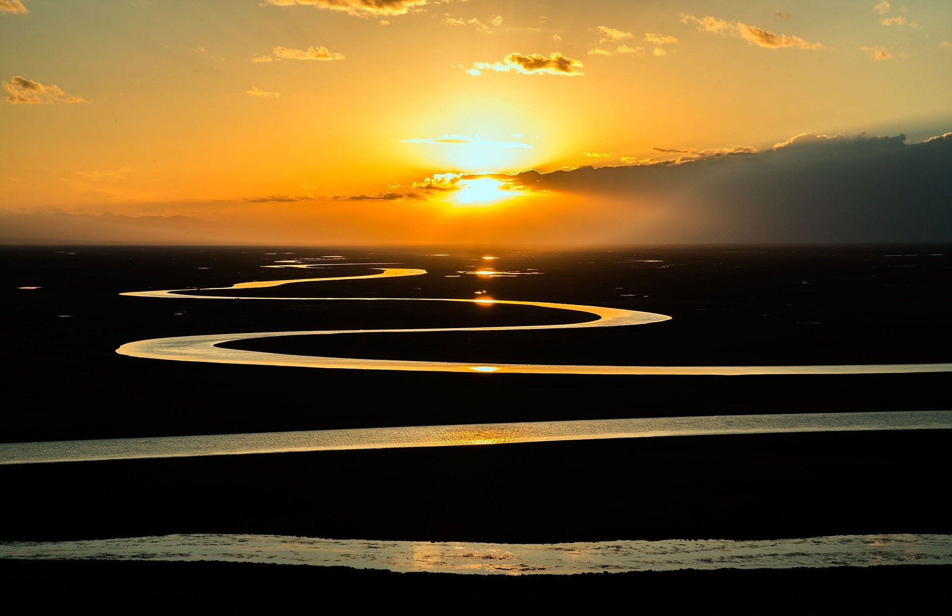 Winding river at sunset